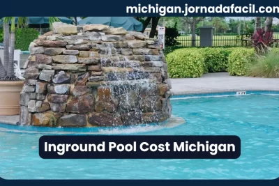 Inground pool cost in Michigan – backyard pool with stone waterfall feature