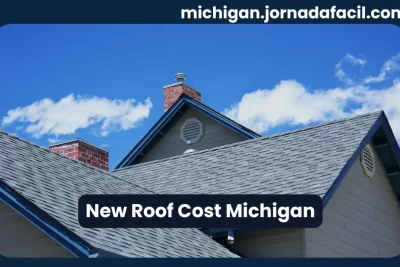 New roof cost in Michigan – shingles on a residential home under a clear blue sky